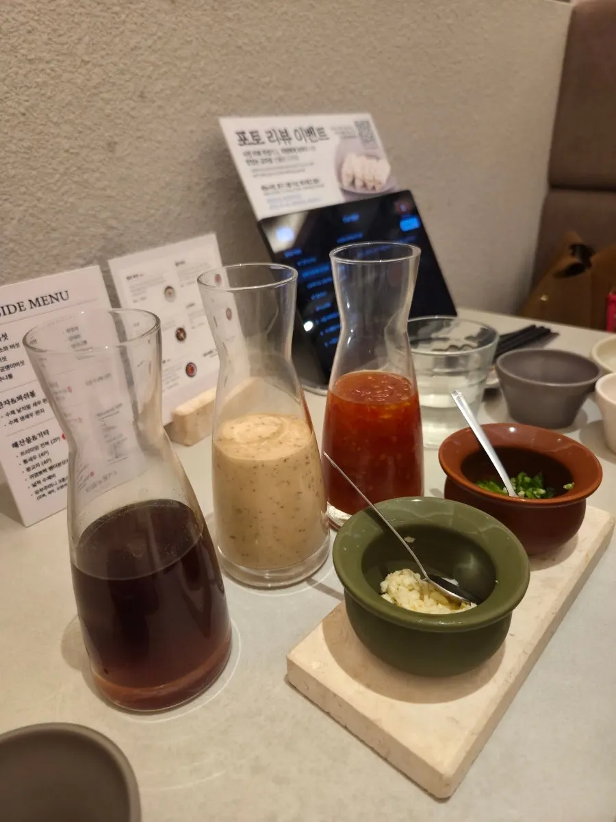 Dipping sauce, minced garlic, and cheongyang chili for shabu-shabu