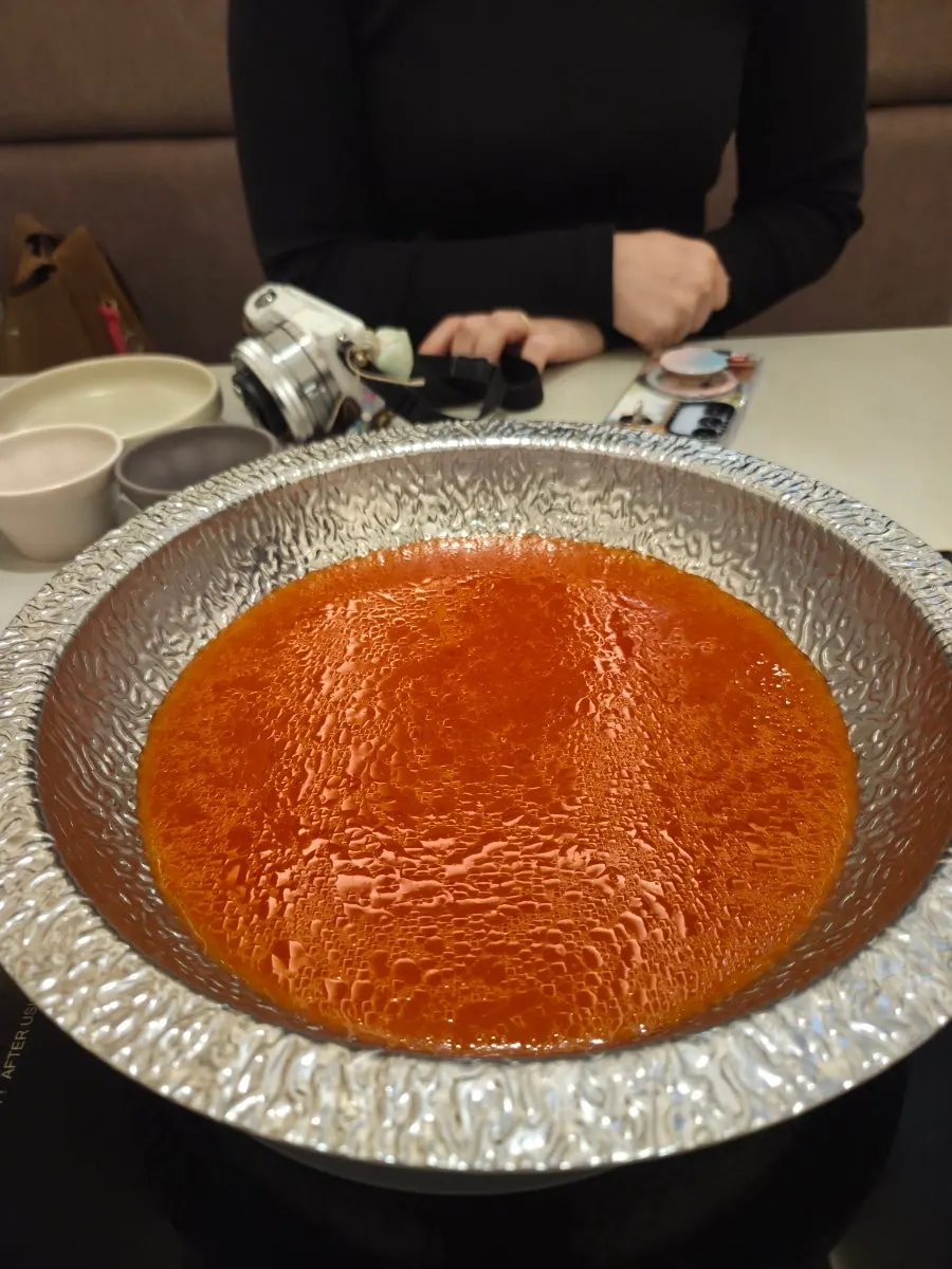 Beef tomato broth starting to boil
