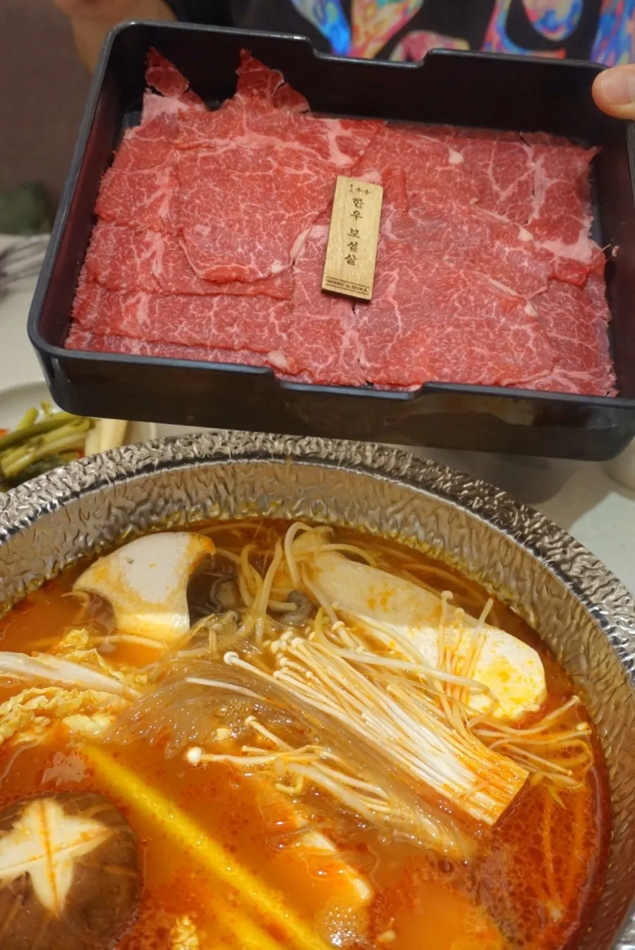 A piece of meat blanched in tomato broth