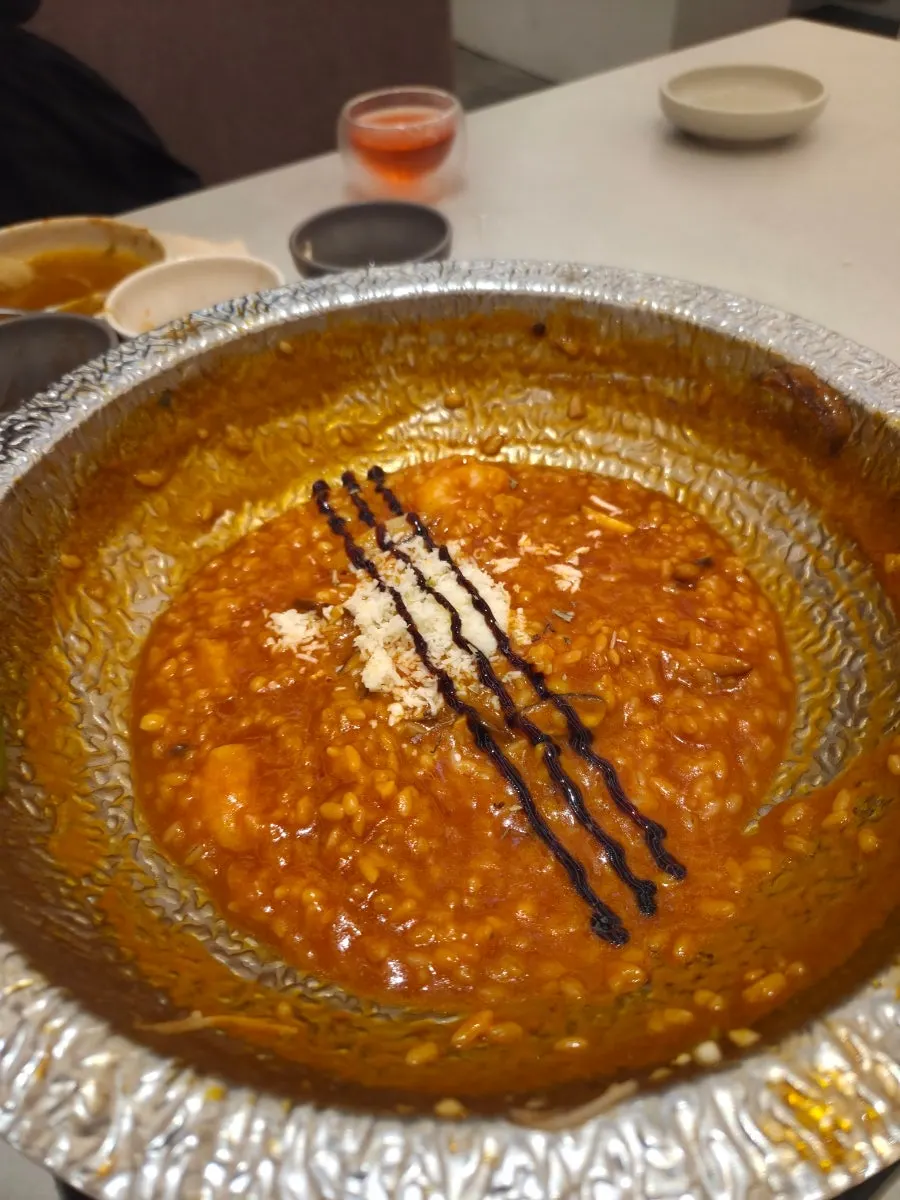 Tomato risotto served as the finishing dish