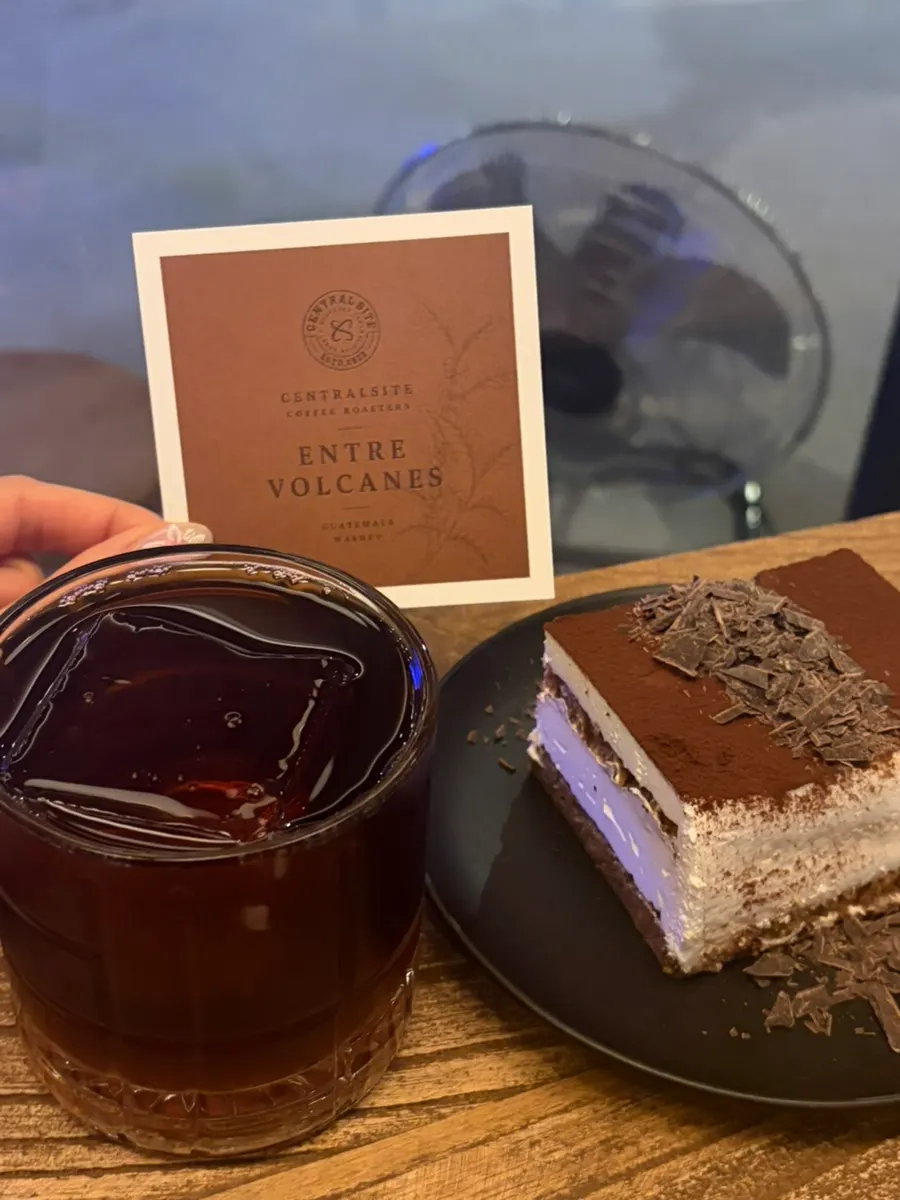 Guatemala drip coffee with square ice cubes alongside classic tiramisu