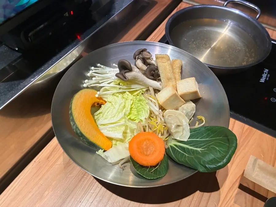 Vegetable plate with mushrooms, bok choy, meatballs, and mul mandu