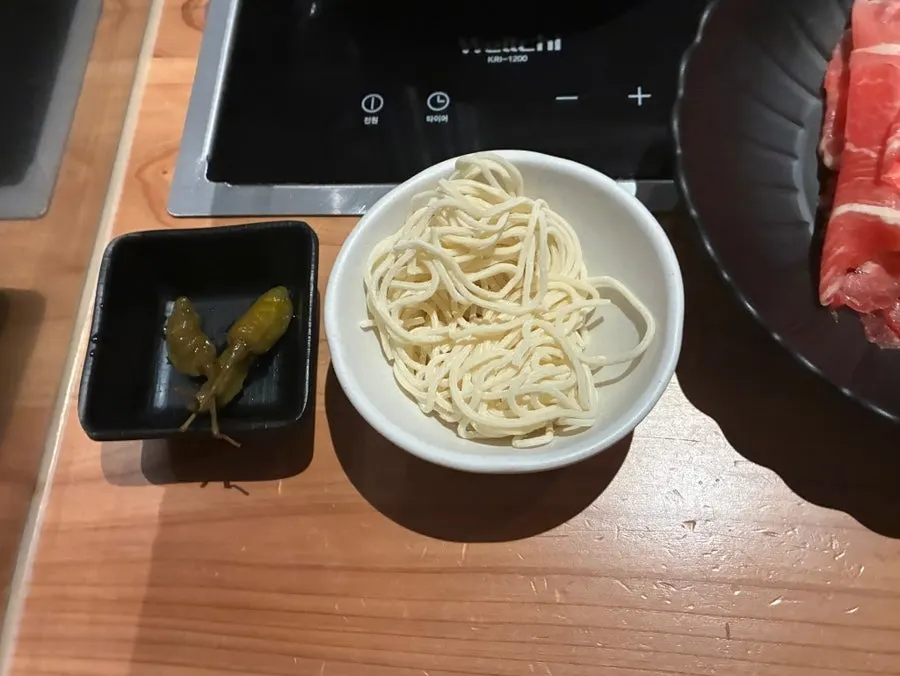 Finishing with kalguksu noodles included in the meal