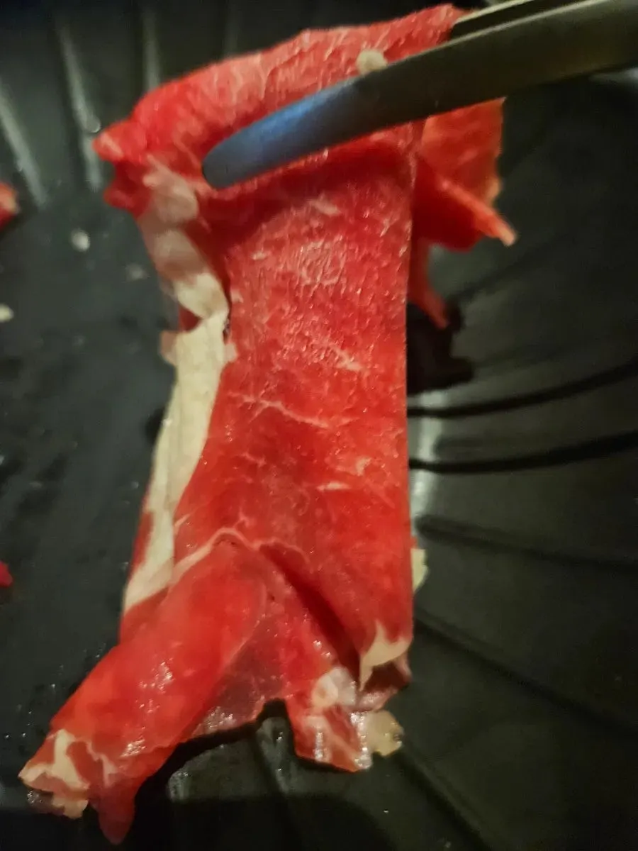 Shabu-shabu served with dipping sauce