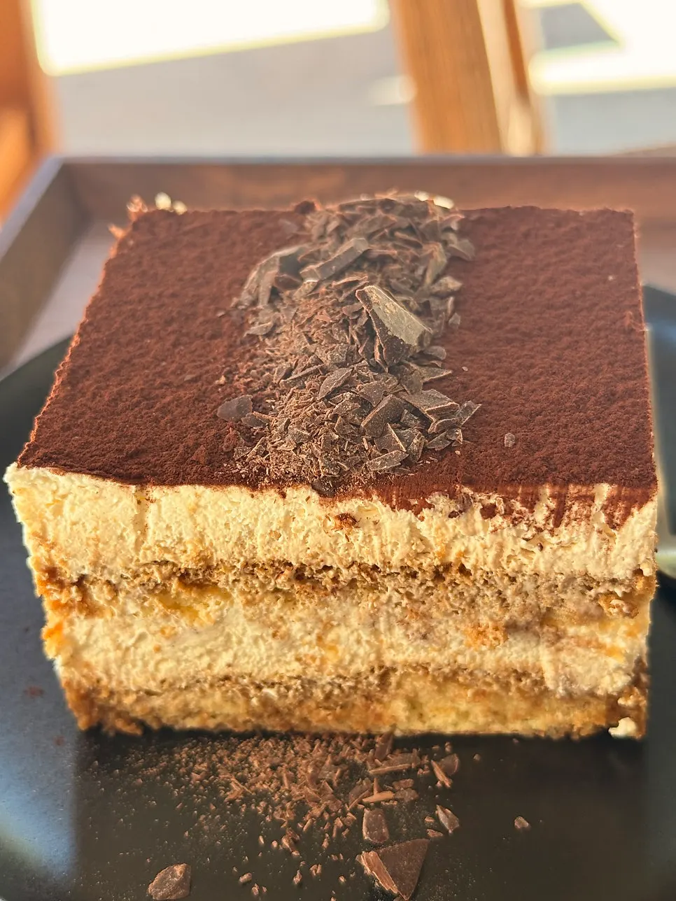 Classic tiramisu topped with cocoa powder