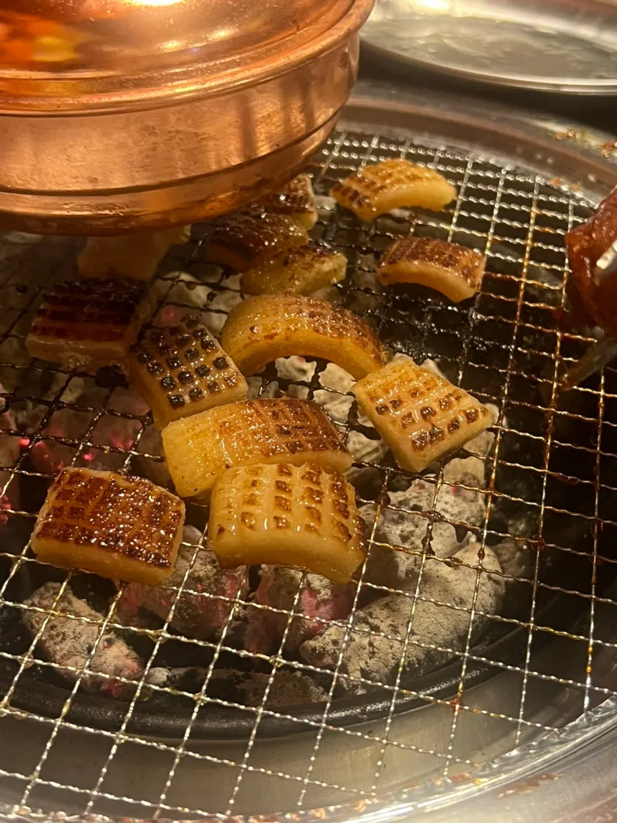 Thick pork skin being grilled