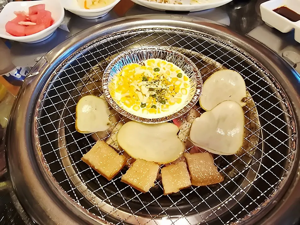 Pork rib table spread with several dishes