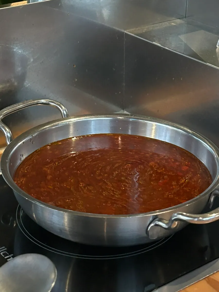 Personal pots of spicy soup and mala soup