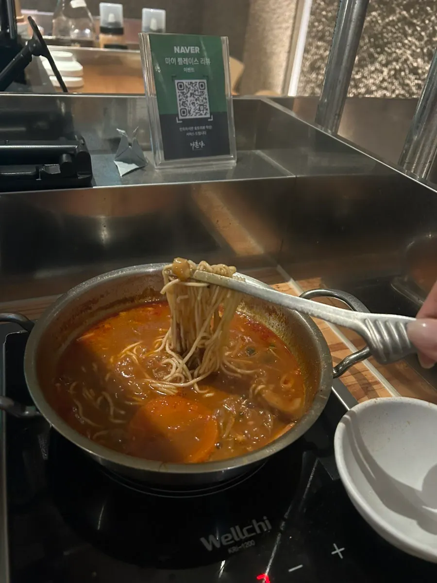 Fresh noodles added to the remaining broth