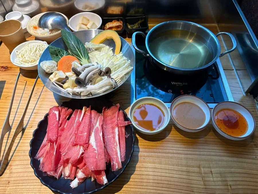 Basic solo shabu-shabu set with broth, vegetables, noodles, and meat