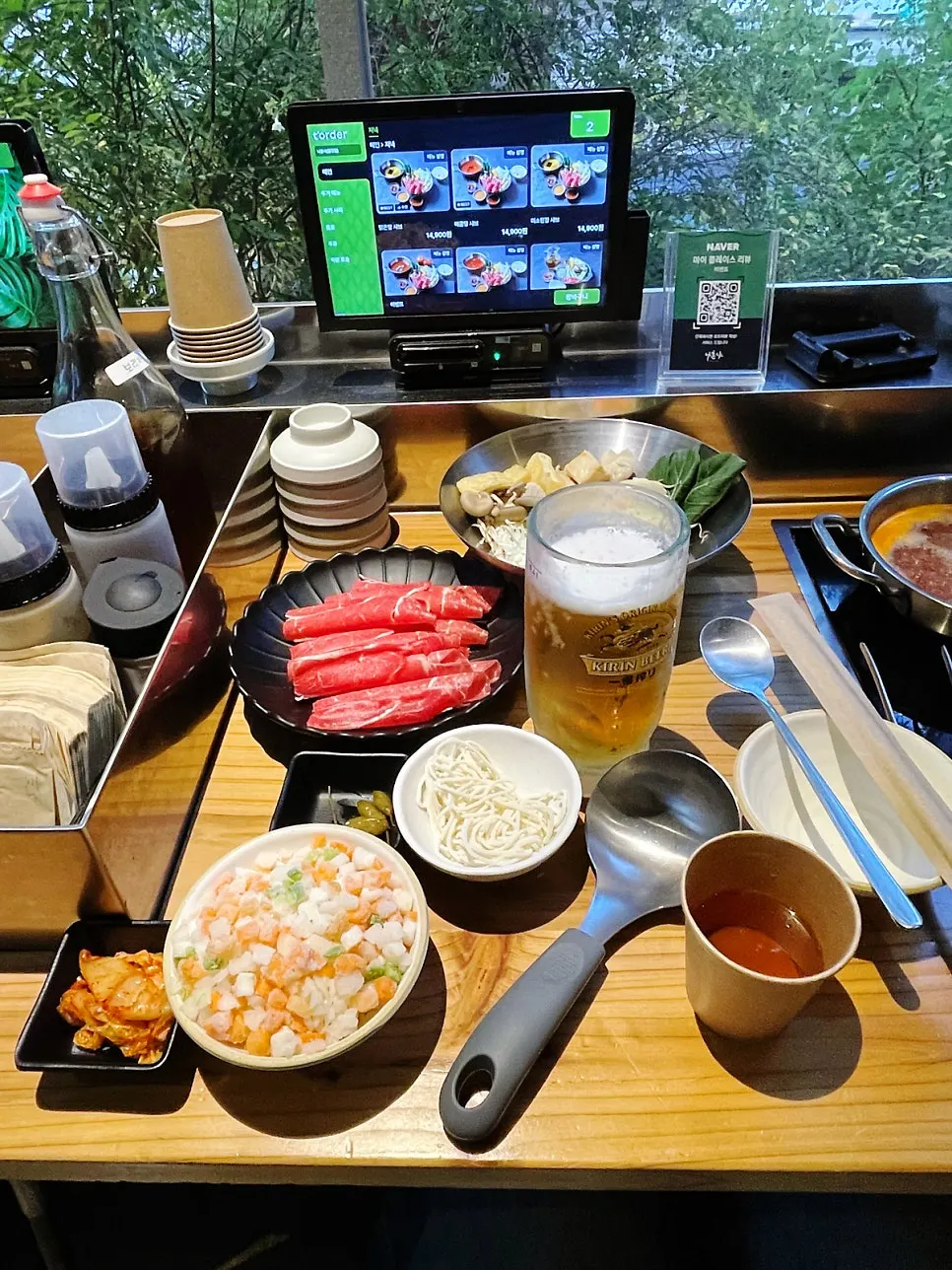 Menu listing mala shabu and tomato broth shabu