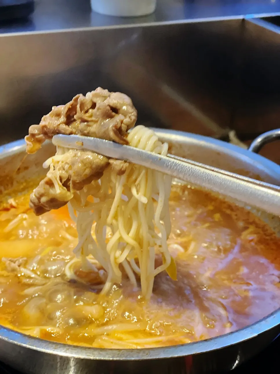 Tomato broth shabu served on a plate