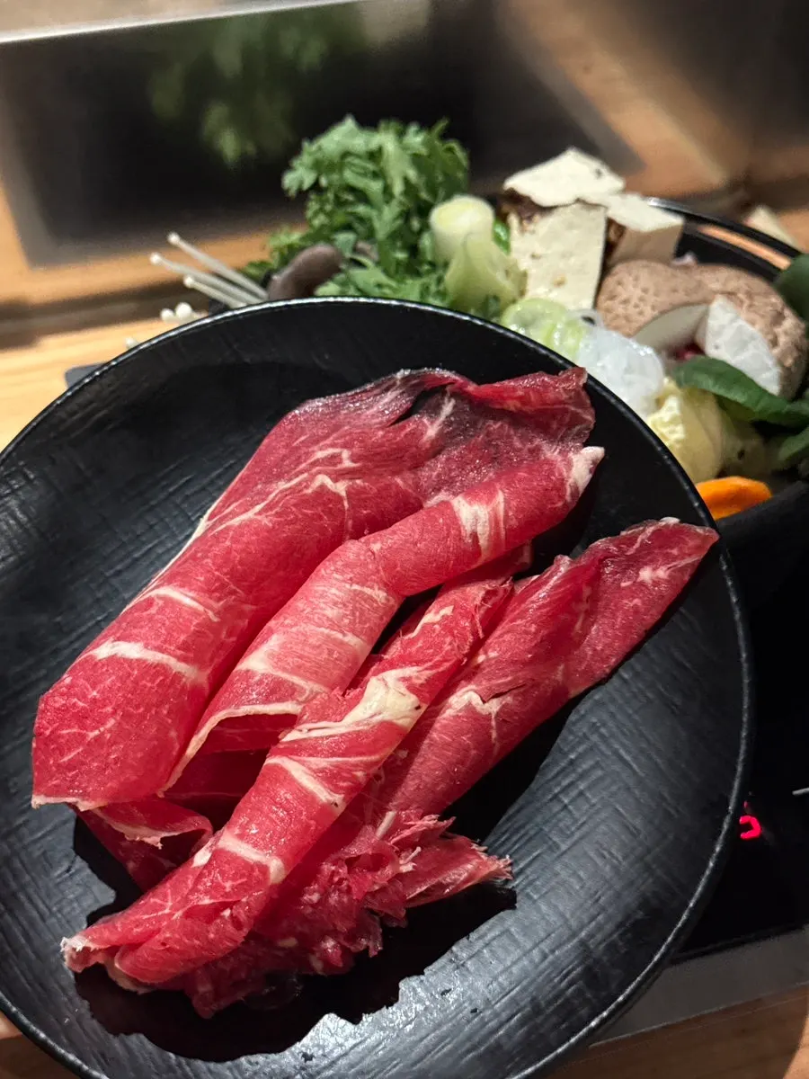 Sukiyaki meat served on a separate plate
