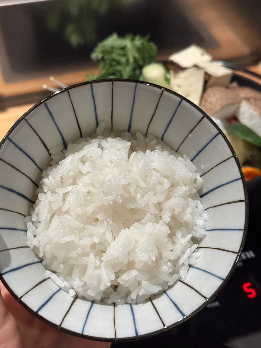 Bowl of rice served with the sukiyaki