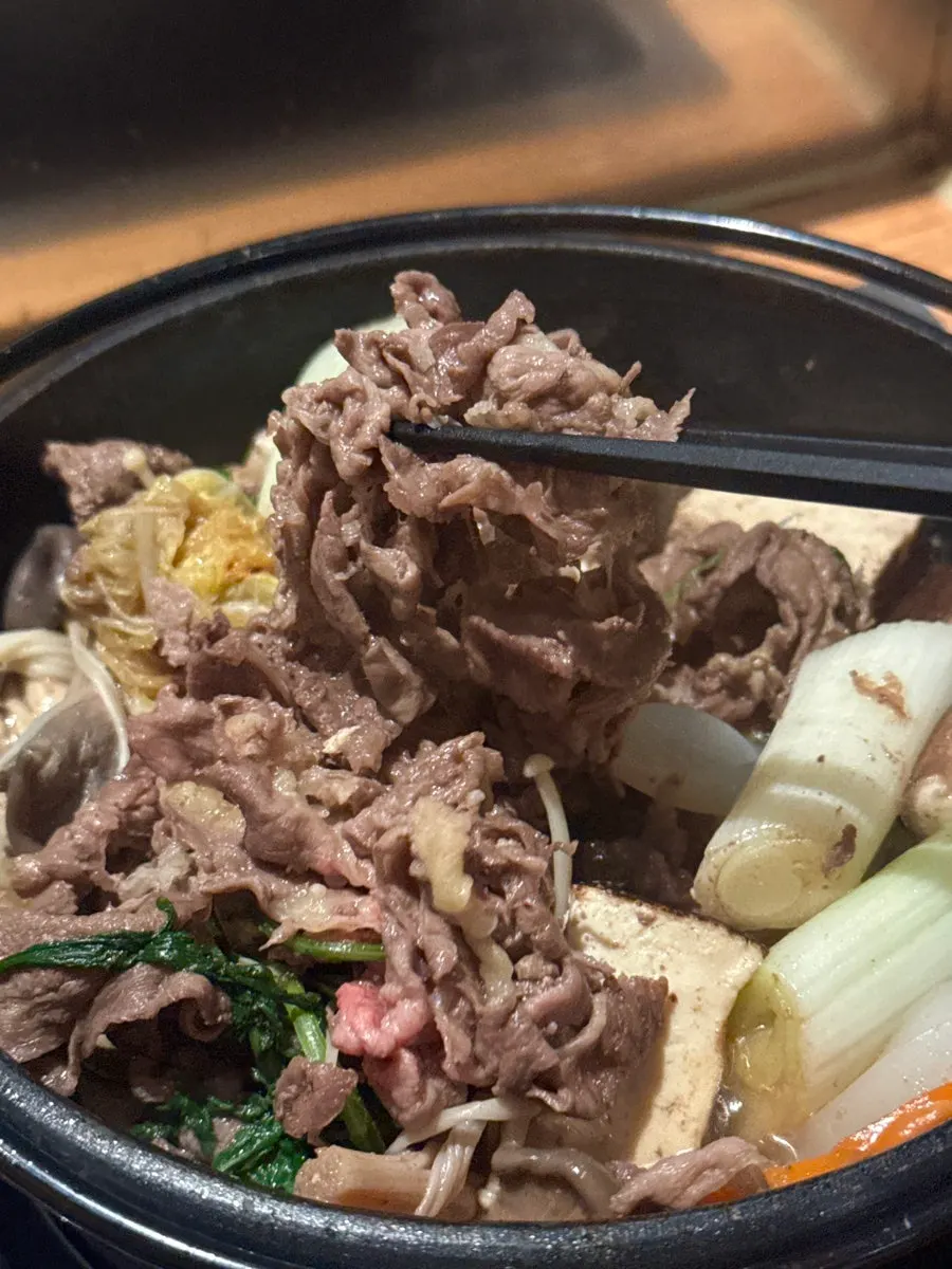 Vegetables and mushrooms boiling in the sukiyaki pot