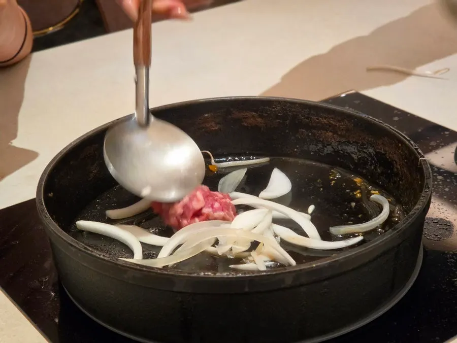 Aki udon finished in sukiyaki broth