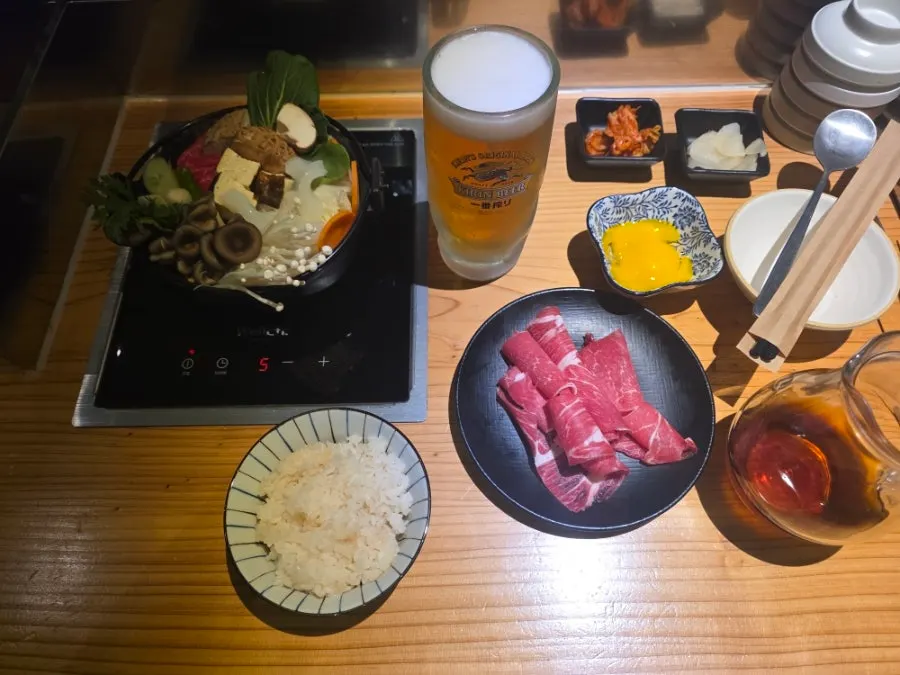 Kirin draft beer enjoyed alongside the sukiyaki