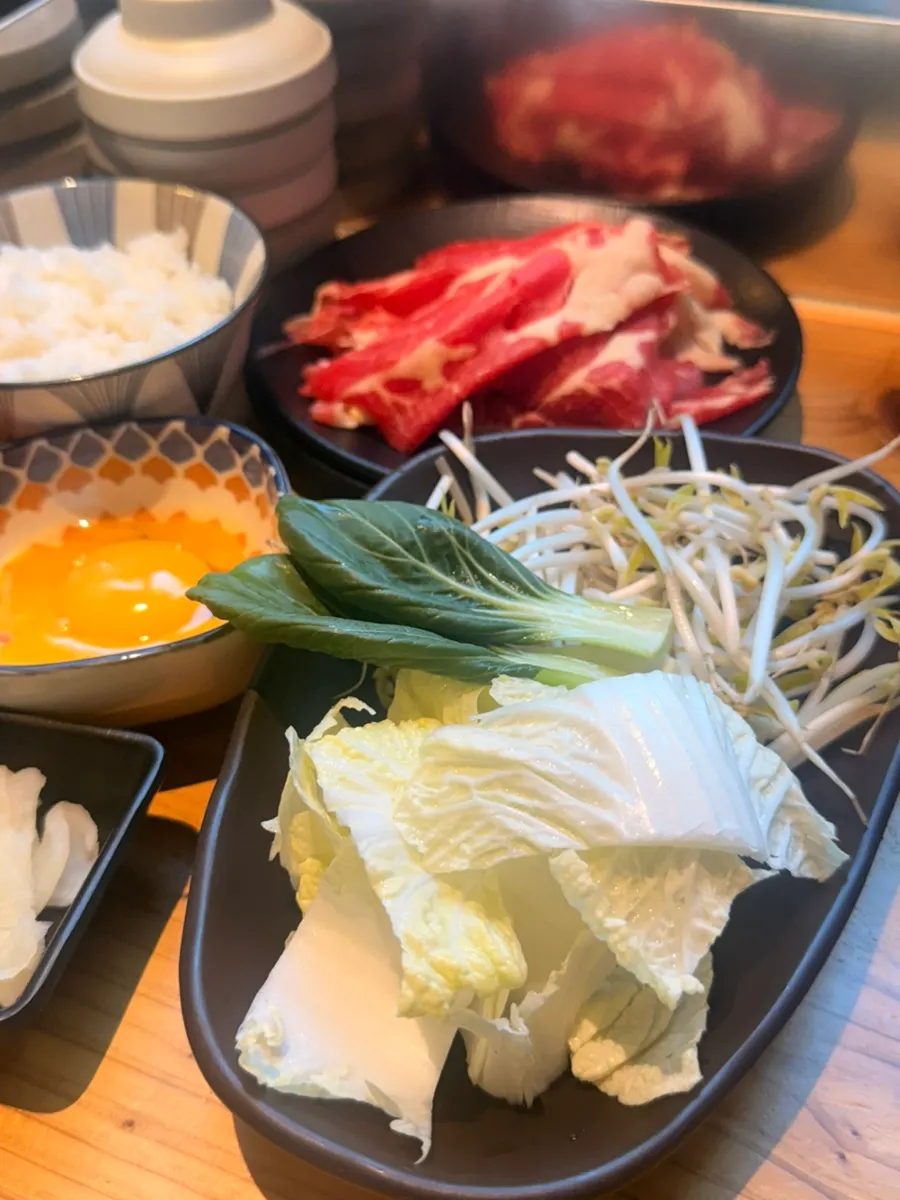 Sukiyaki meat dipped in egg sauce