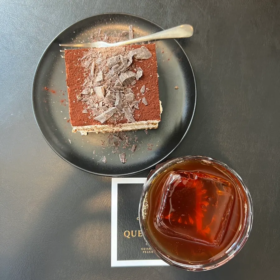 Table with classic tiramisu and a hand-drip coffee