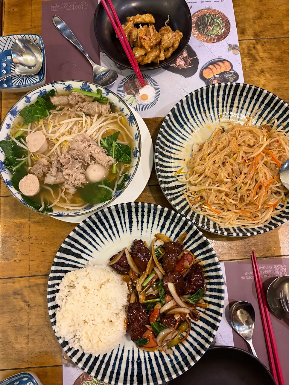 Three Thai dishes laid out on the table