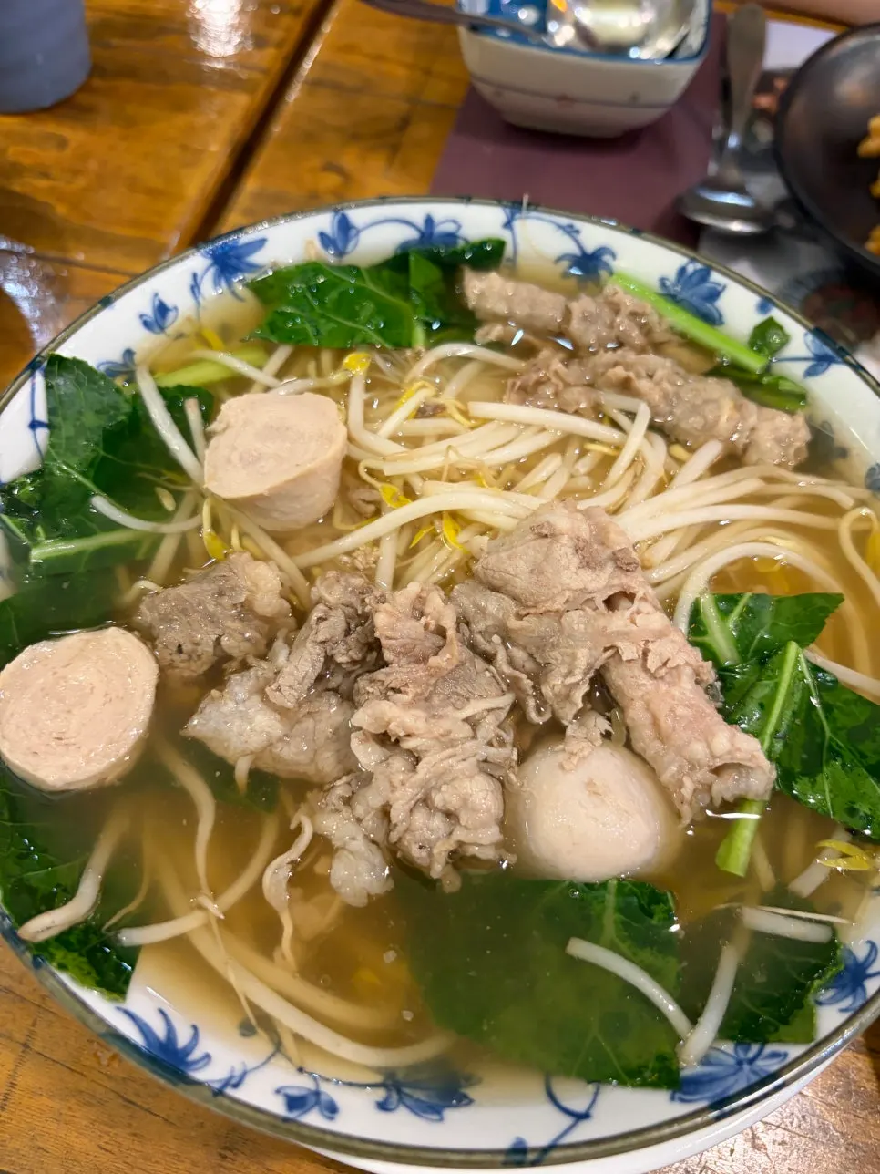 Lifting noodles out of the Thai rice noodle soup