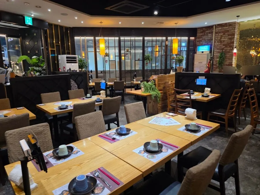 Interior of Saeng Augustine Hapjeong Branch with wide table spacing