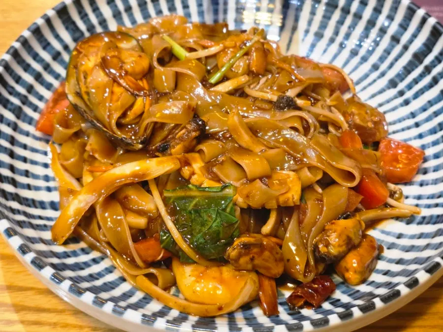 Plate of Thai chili noodles with a smoky char