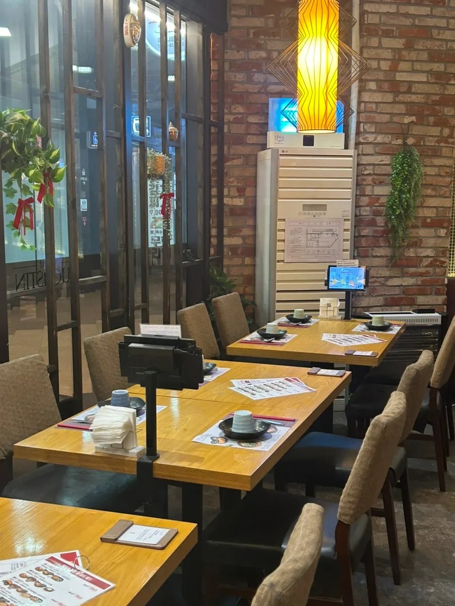 Interior of Saeng Augustine Hapjeong Branch decorated with brick and wood tones
