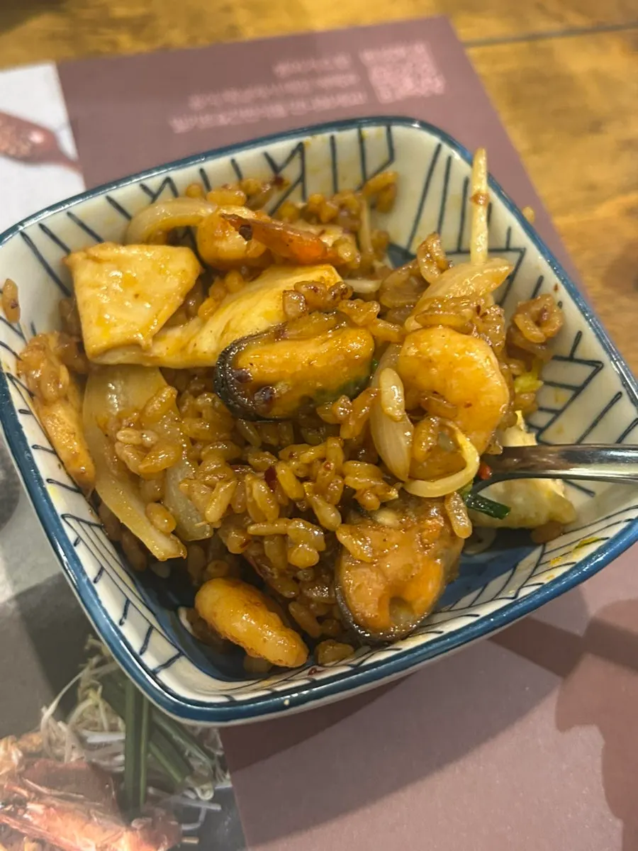 Nasi goreng showing shrimp, squid, and other seafood