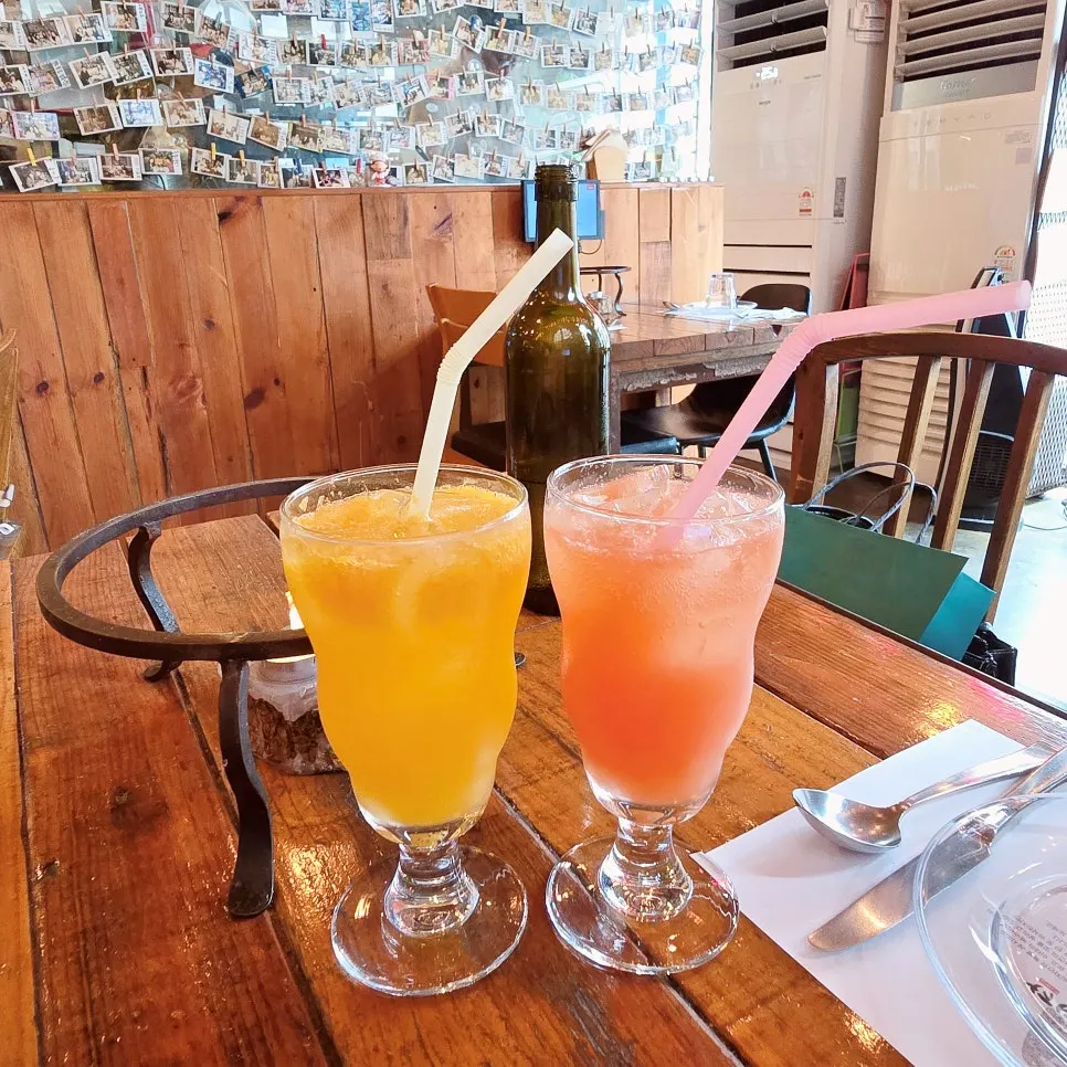 Two glasses of fresh fruit orange and grapefruit ade