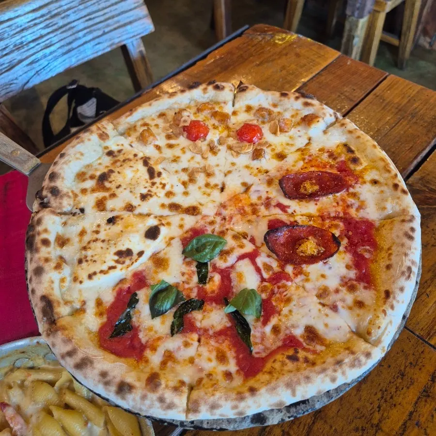A whole Quattro Stagioni pizza with four flavors
