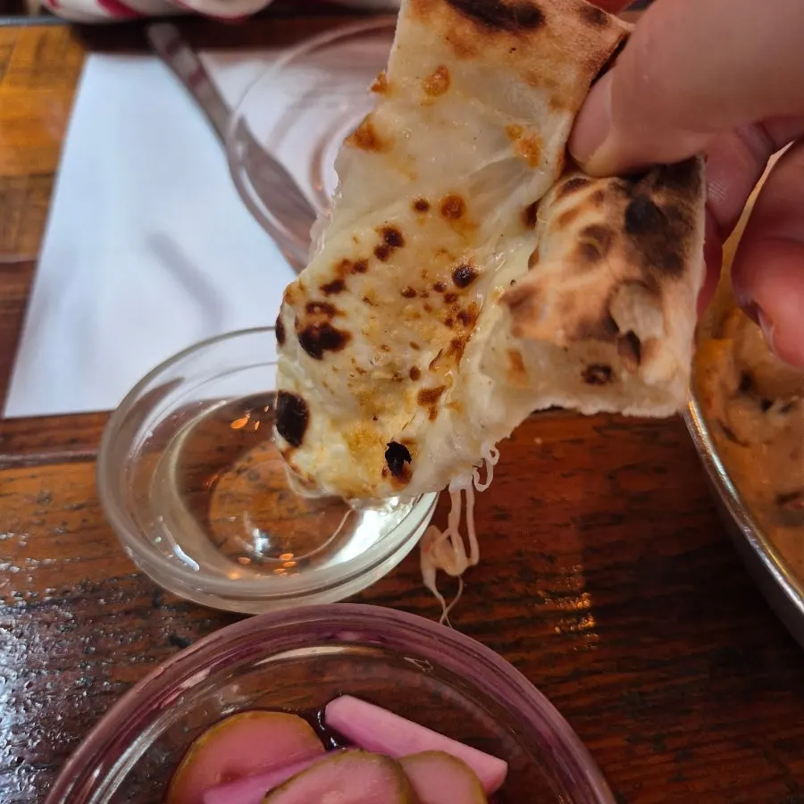 A plate with several pizza slices sampled