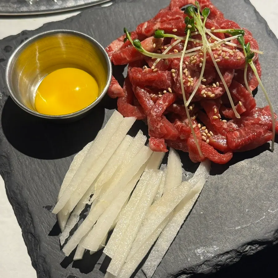 Hanwoo beef tartare served with julienned pear and egg yolk