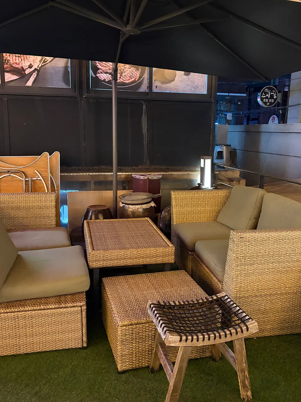Jeongyukdo's outdoor garden patio seating with earthenware jars