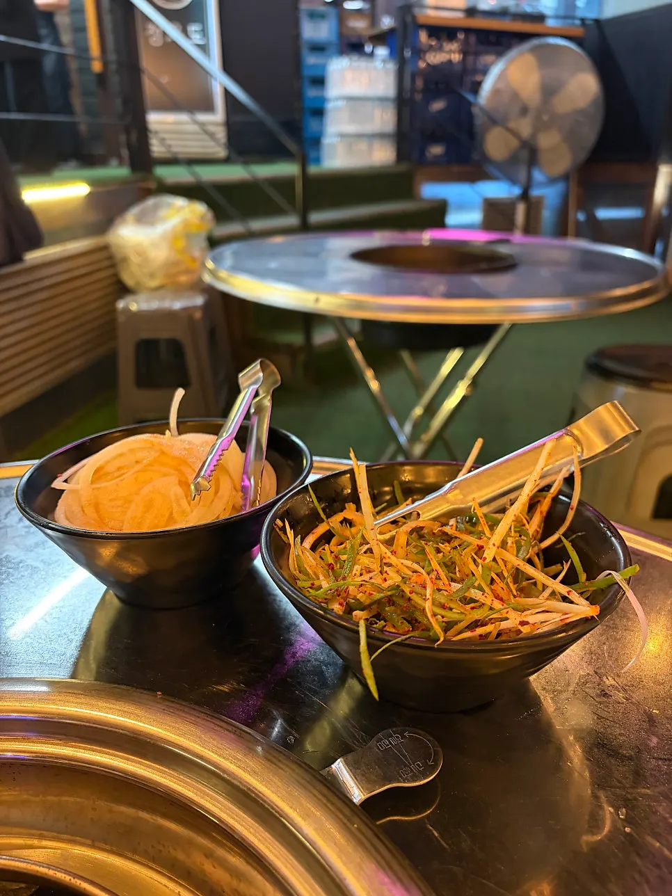 Pickled onion and green onion salad set on an outdoor table