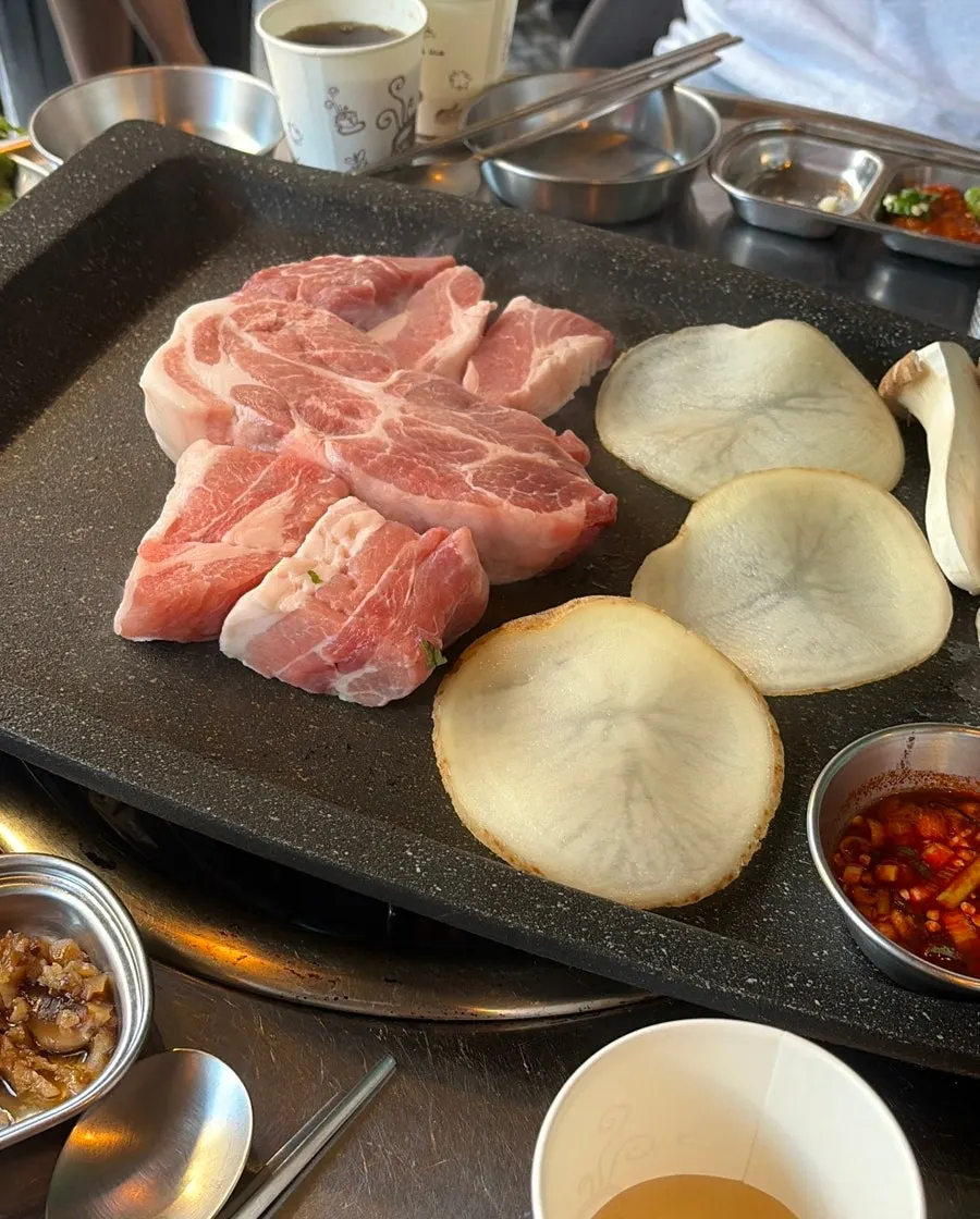 Grill loaded with meat, potato, and mushrooms