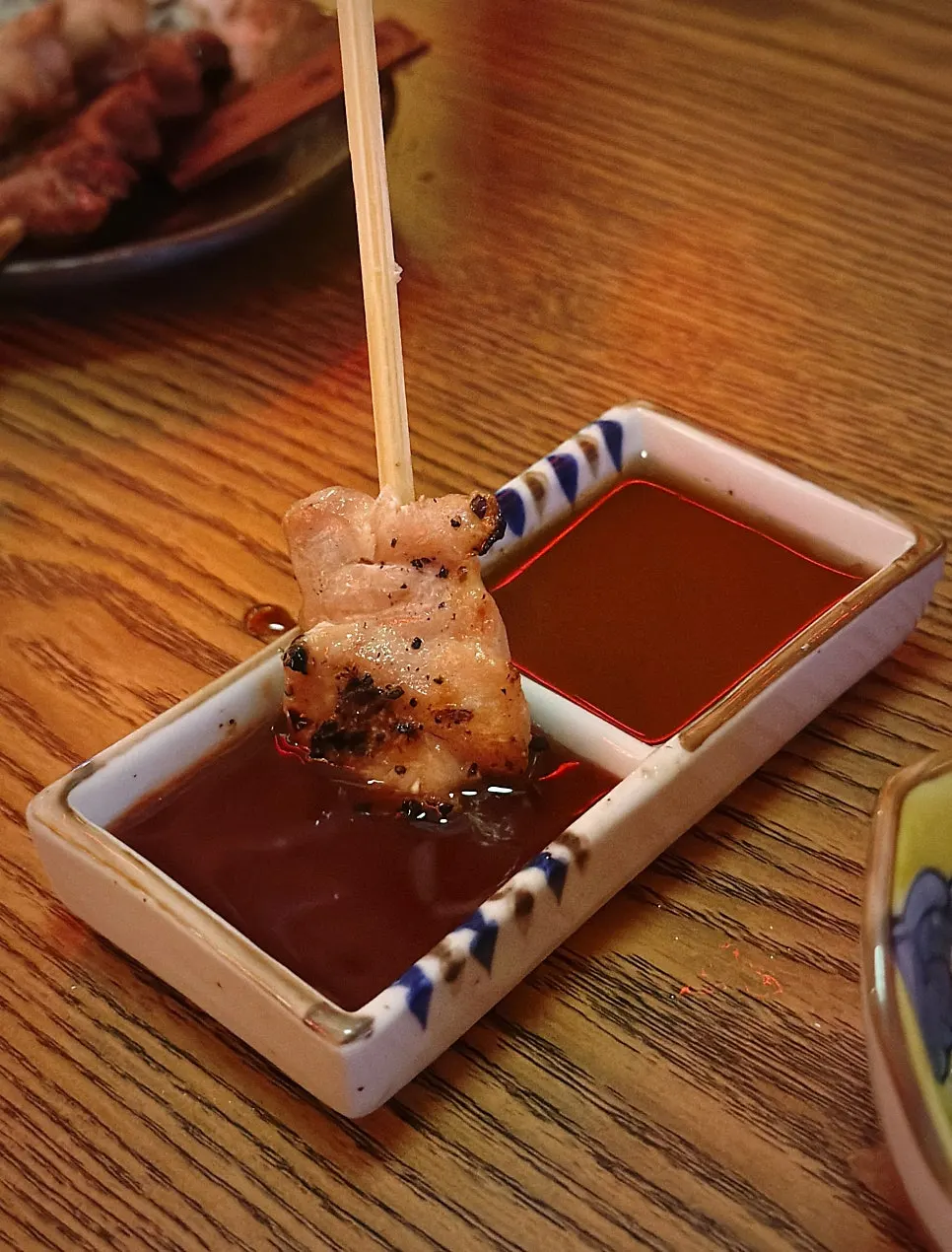 Native chicken skewers infused with charcoal aroma