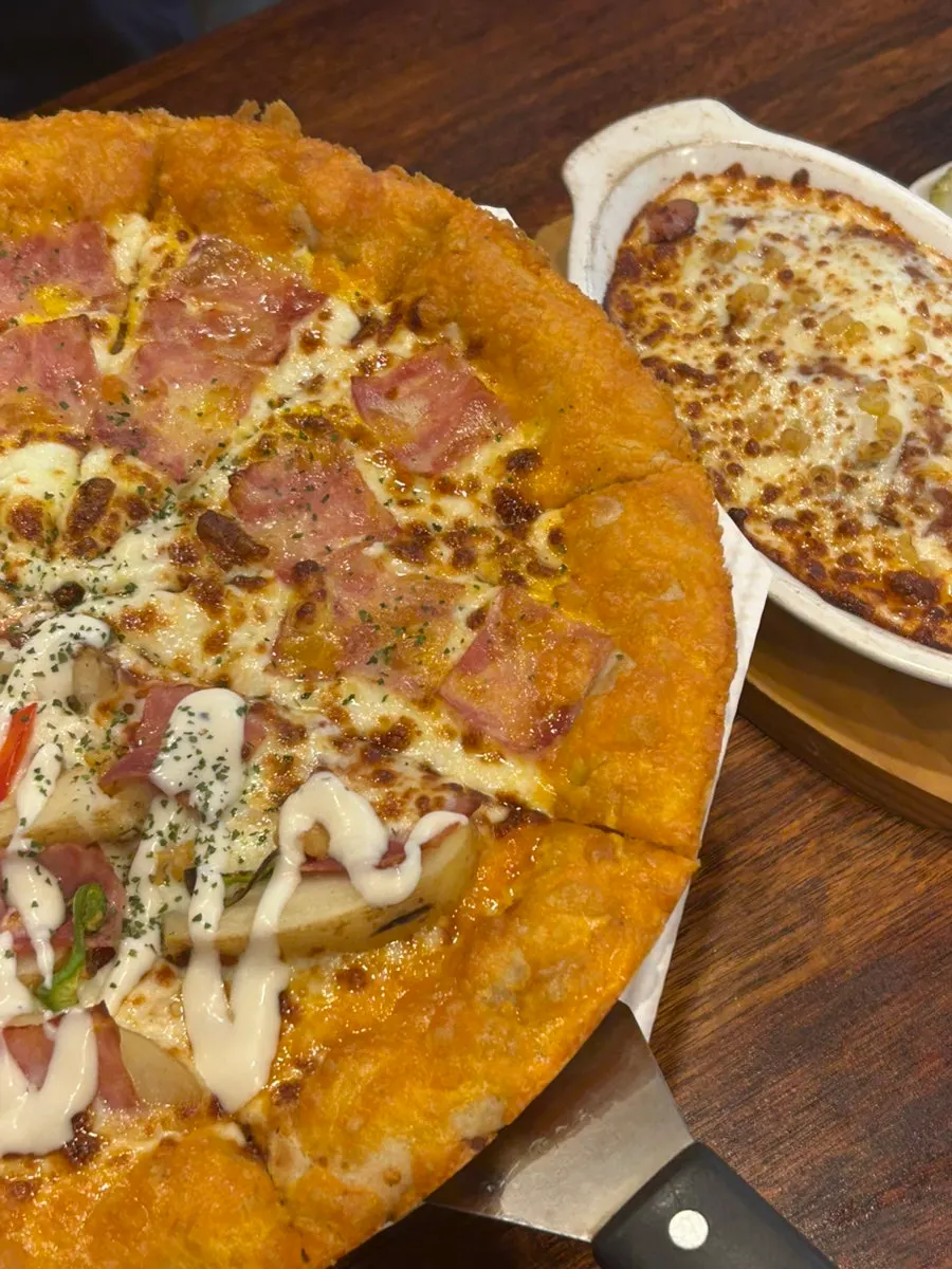 An empty plate after two people finished the pizza