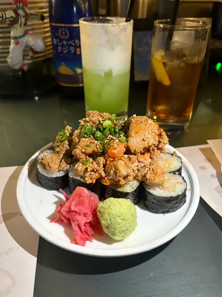 Picking up a piece of ankimo salt gimbap