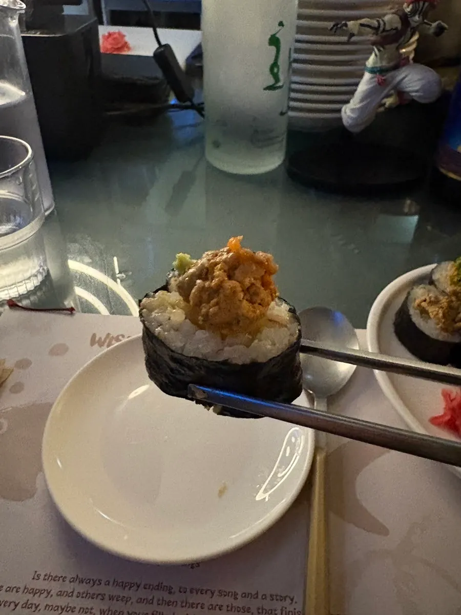 A bite of rich ankimo-topped gimbap