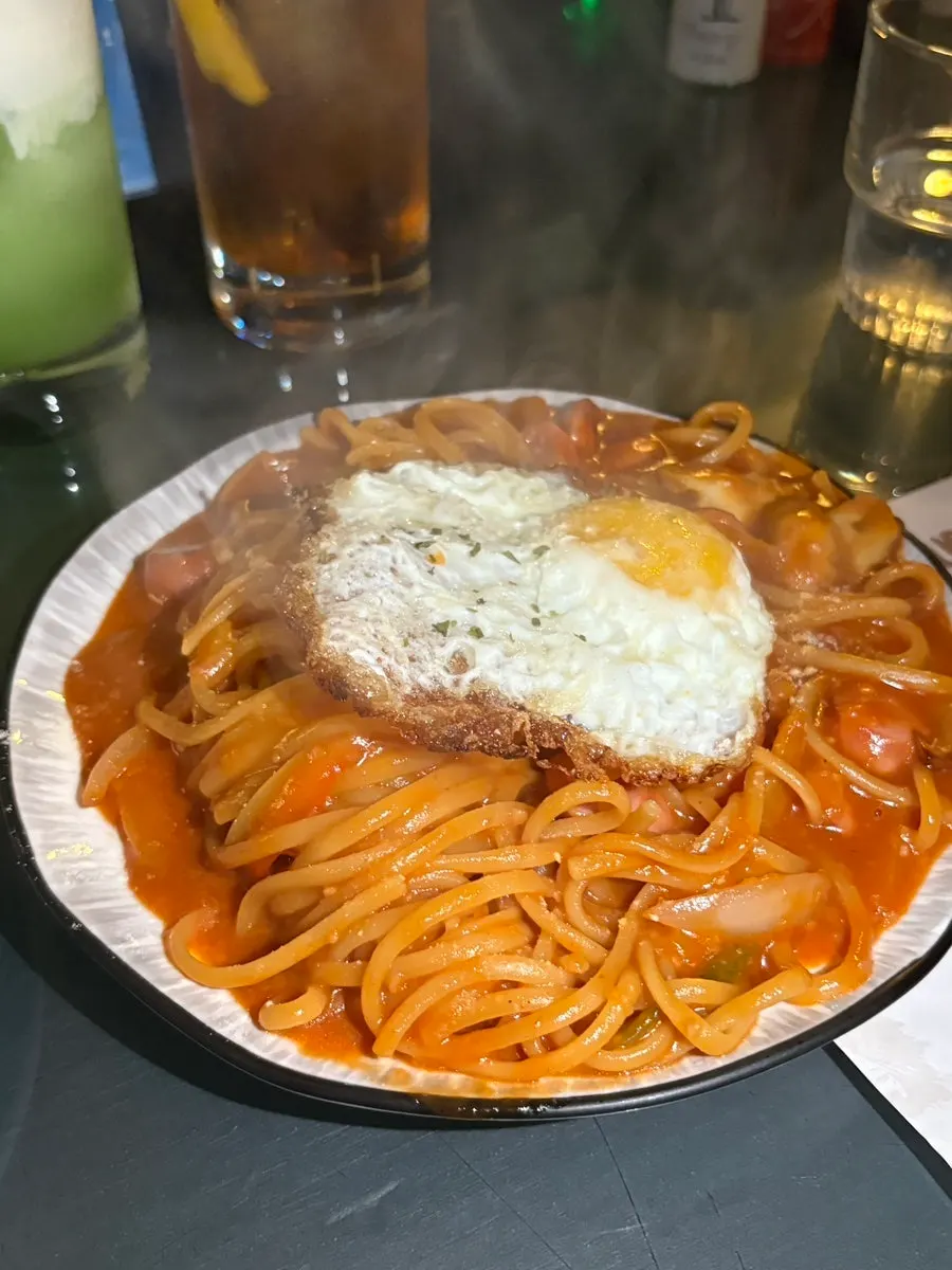 Noodles coated in ketchup sauce for the Napolitan pasta