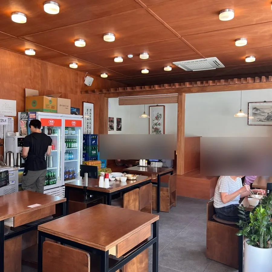 Spacious interior decorated in wood and white tones