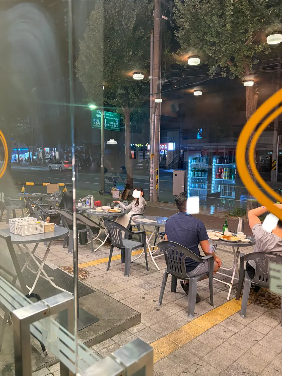 Outdoor tables set up in front of the restaurant