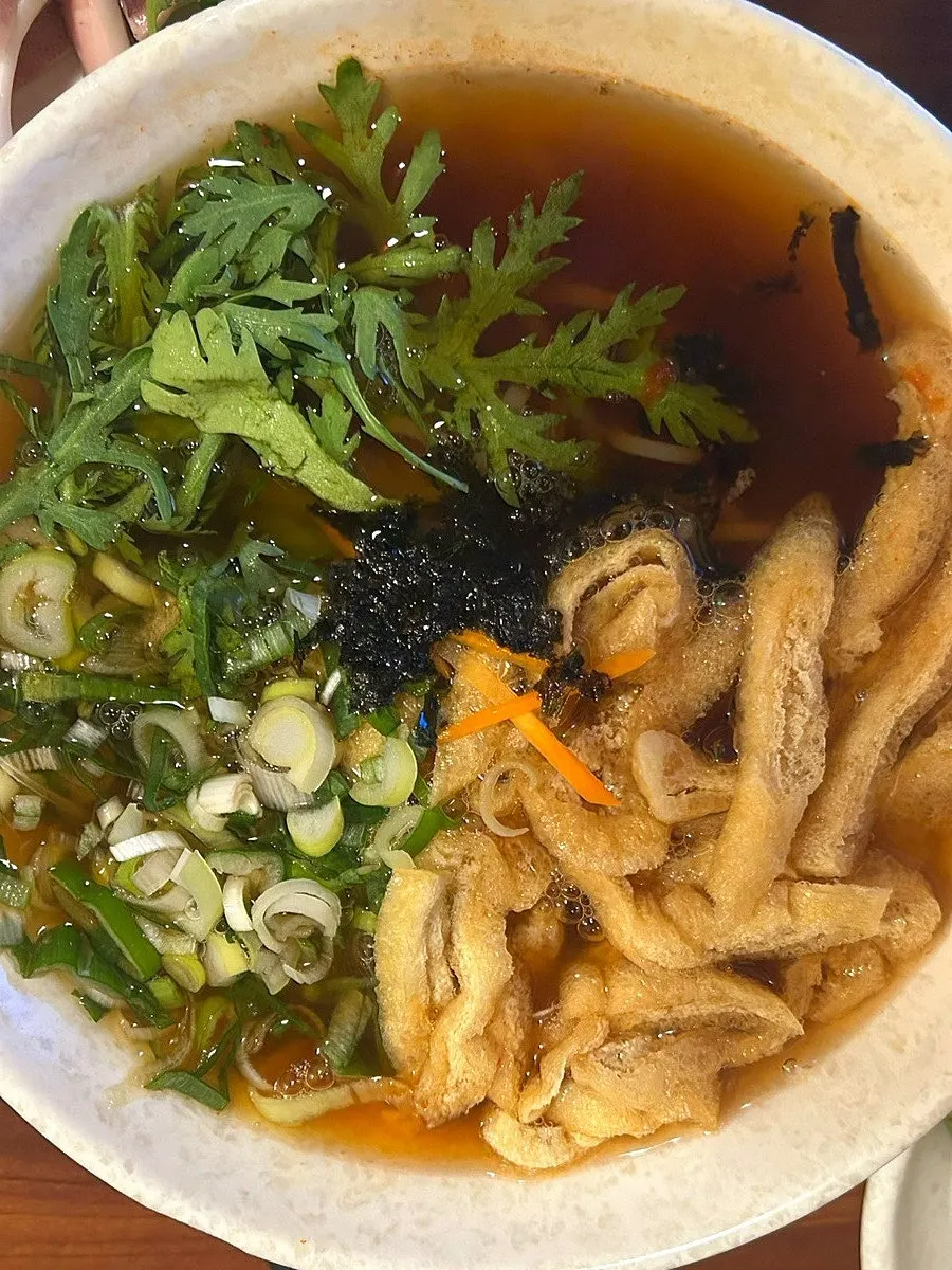 Bowl of gakgi udon ordered in regular spice level