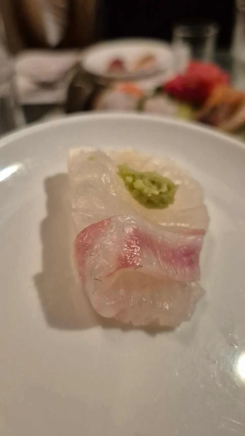 Picking up a piece of aged sashimi