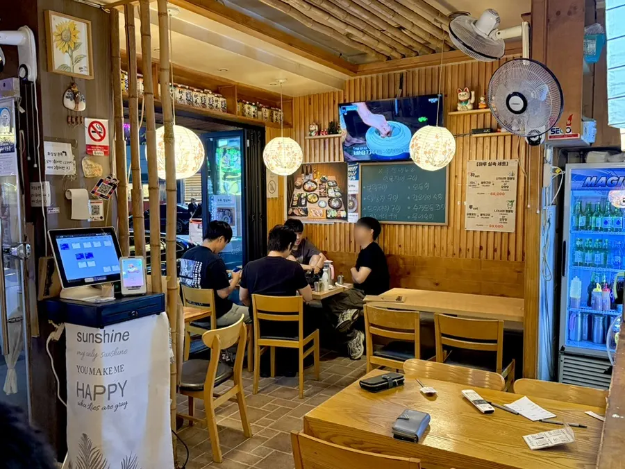 Interior of Haru with windows wide open for an open-air feel