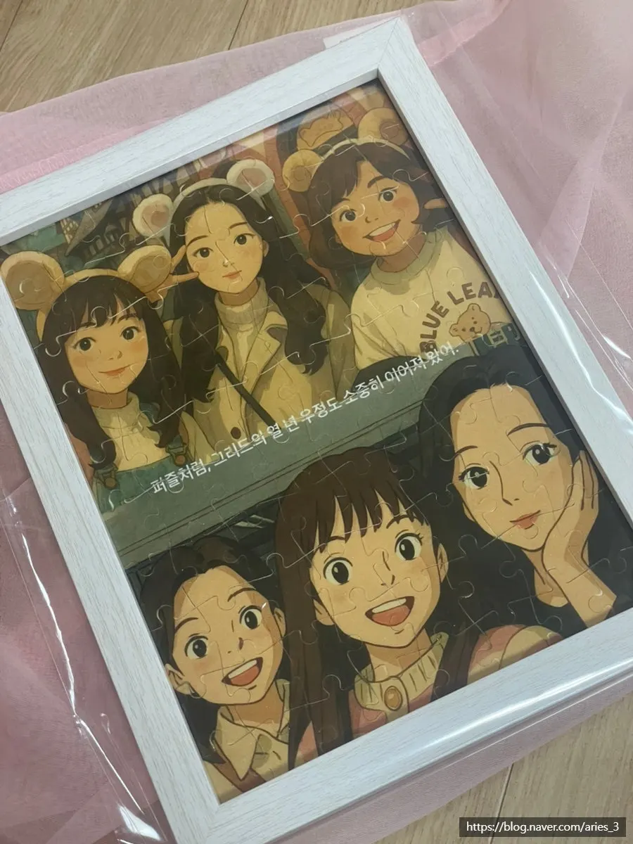 액자와 함께 선물받은 완성 사진 퍼즐
