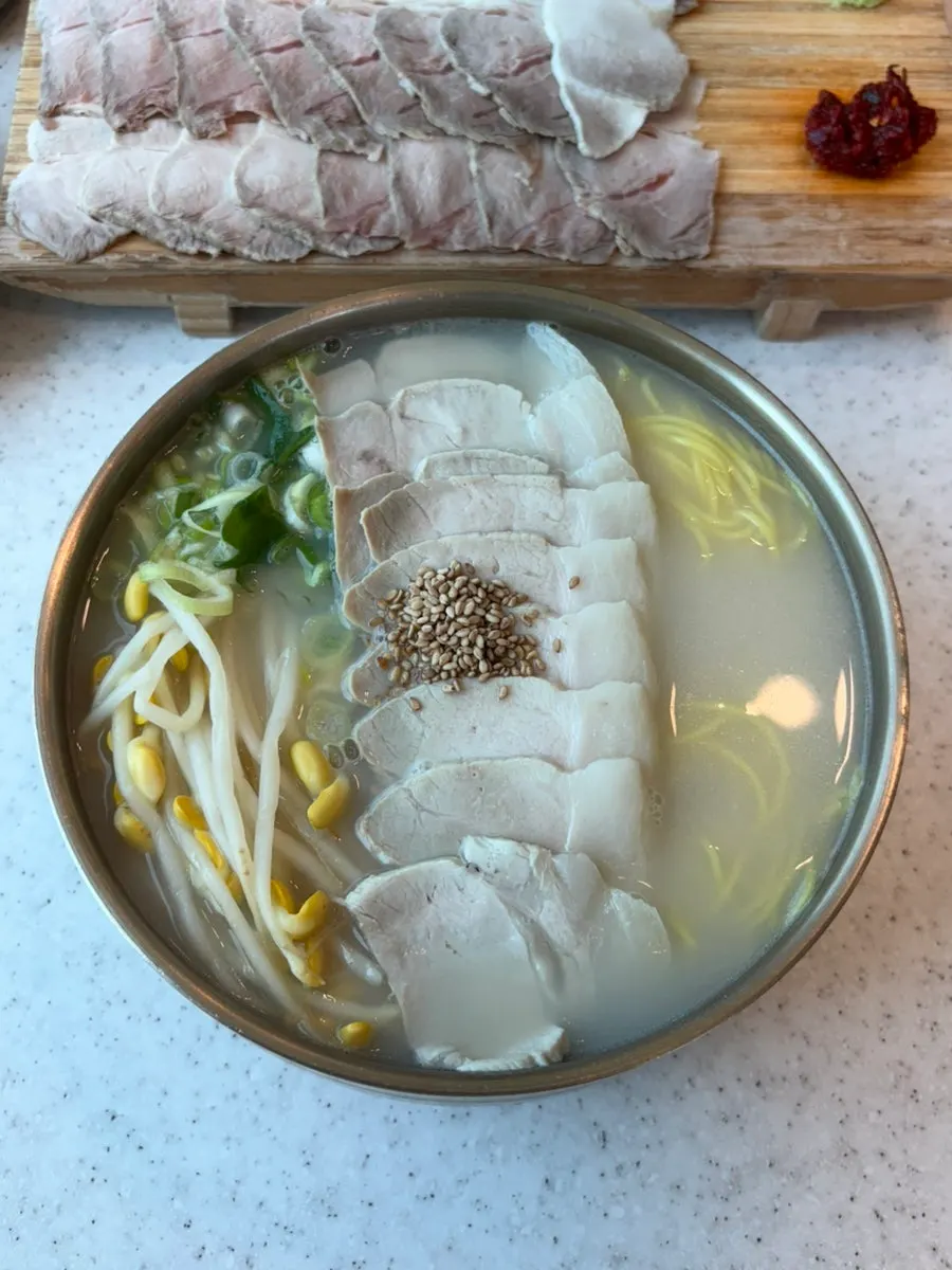 A bowl of noodles placed by the window