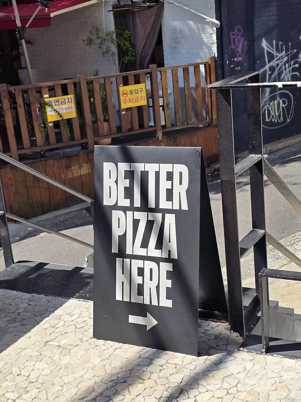 Entrance with the phrase BETTER PIZZA HERE