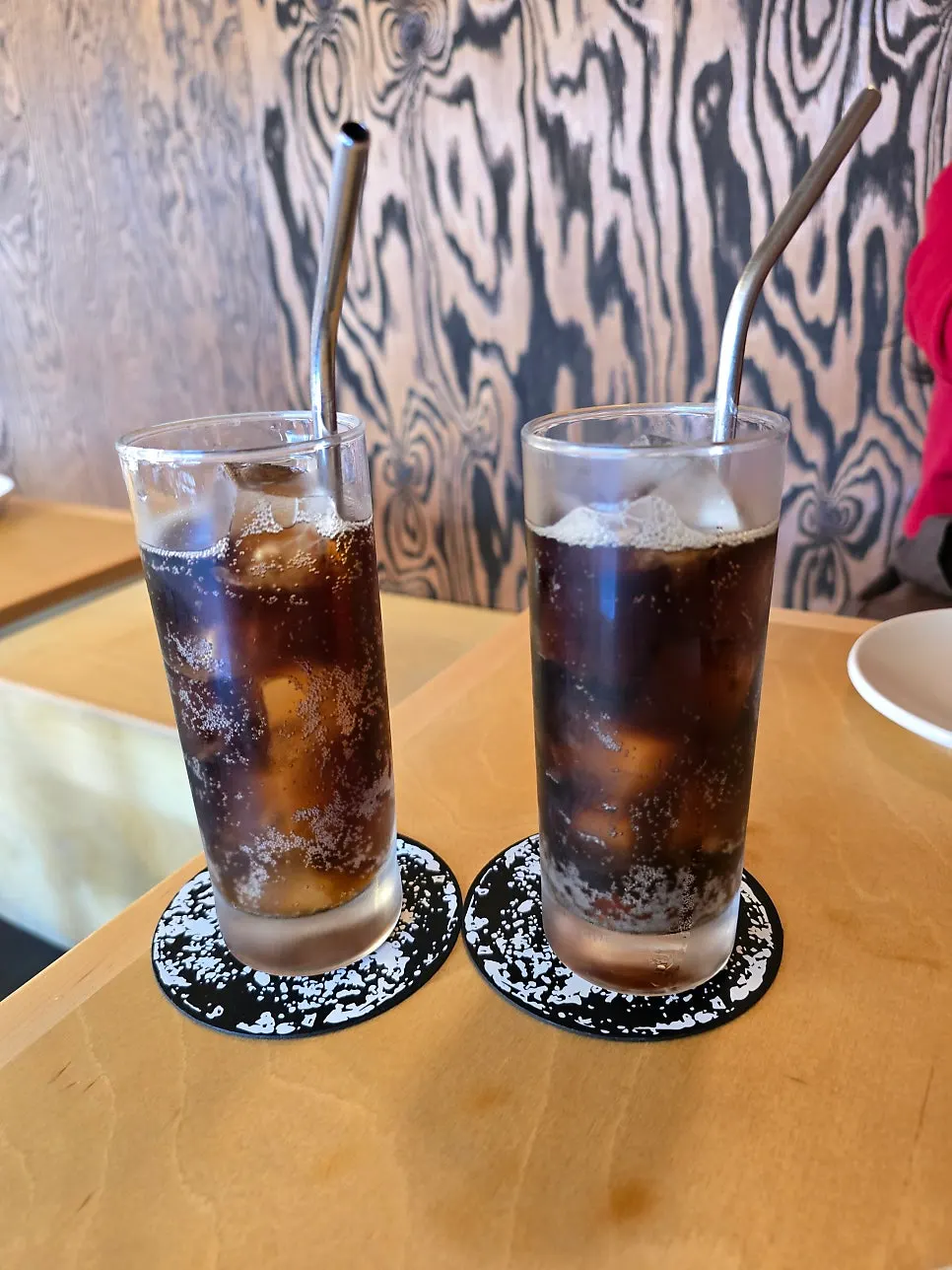 Two colas with stainless steel straws